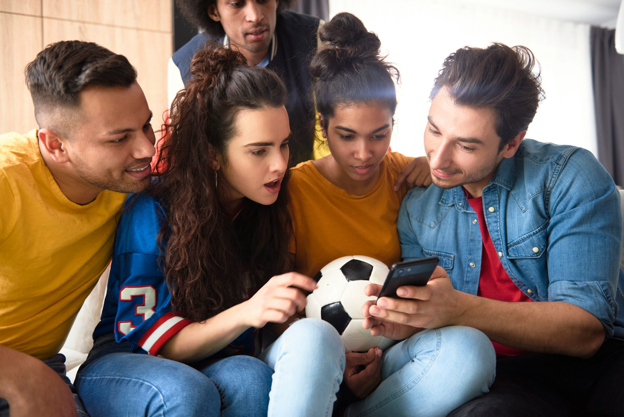 A group of friends watching a live GameTap Now stream together on a phone